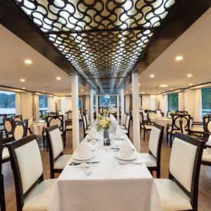 ourmet dining on board Amanda Legend Cruise with a stunning sunset view