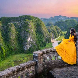 Panoramic view from the top of Mua Cave, Ninh Binh - A breathtaking overlook of the Tam Coc valley and surrounding limestone mountains.