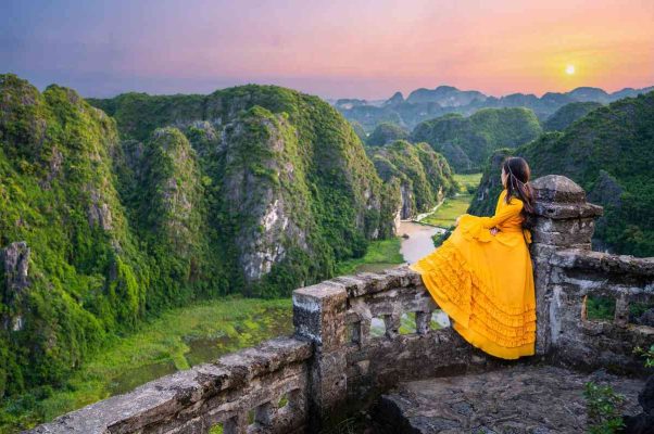 Panoramic view from the top of Mua Cave, Ninh Binh - A breathtaking overlook of the Tam Coc valley and surrounding limestone mountains.