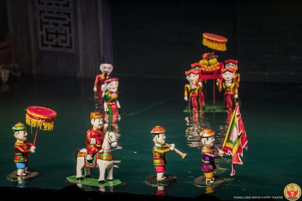 A vibrant water puppet show in Hanoi, Vietnam, showcasing traditional folklore and cultural storytelling through wooden puppets on water